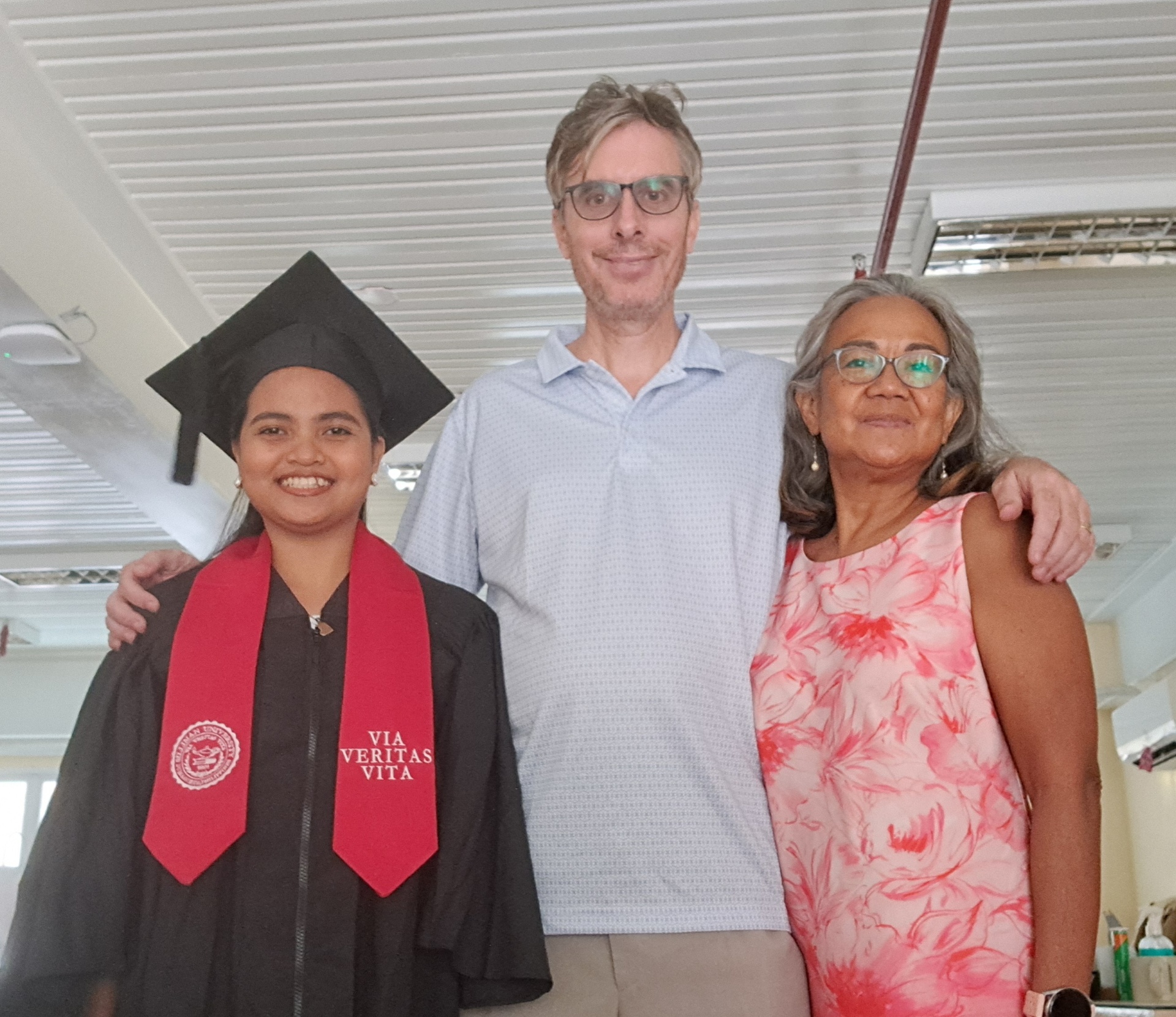 Andrew and Gilda Scribner with Gie Arquisal, their adopted daughter, at her graduation